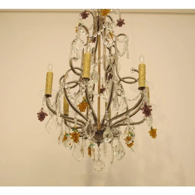 Vintage Italian six arm beaded glass chandelier with amber and amethyst color grape clusters, crystal pendants and glass...