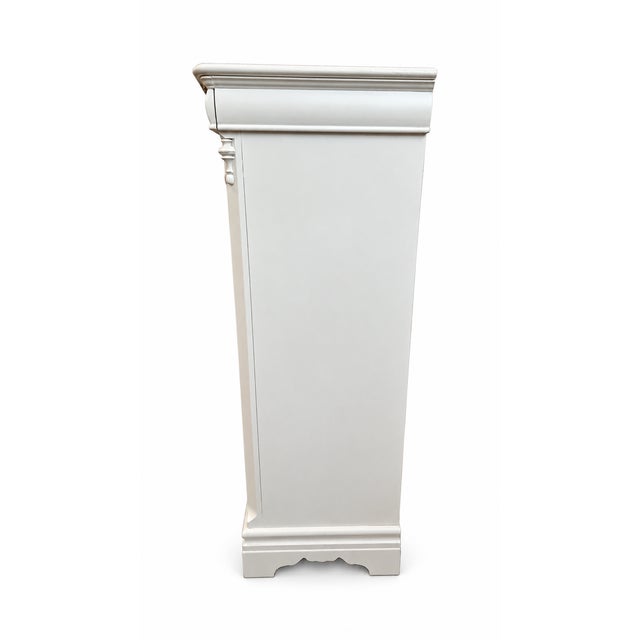 An elegant tall chest by Betty Cameron for Lexington, thoughtfully refinished in a soft white and featuring a distinctive...