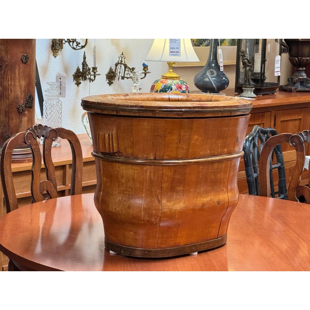 Design Plus Gallery presents a 19th Century Chinese Baby Bath. Constructed from staved wood, the vessel has an undulating...