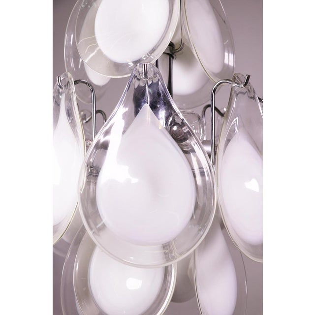 Elegant design pendant lamp chandelier with white and clear glass petal shaped hand blown murano glass elements on a...