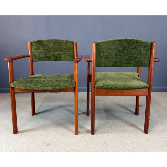 Exceptional set of Scandinavian modern stacking armchairs crafted in richly grained teak, likely produced in Denmark or...
