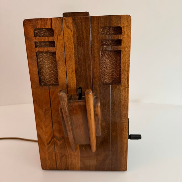 This 1930’s crank telephone looks like it came from a Frank Lloyd Wright home with the beautiful wood box! It is a magneto...