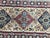 20th century Turkish rug with a geometrical design and yellow field and blue, red, brown and grey, entirely hand knotted...