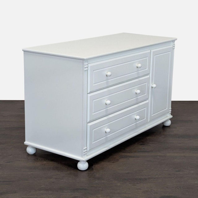 This Bellini dresser features a clean white finish, three spacious drawers, and a side cabinet with two shelves for extra...