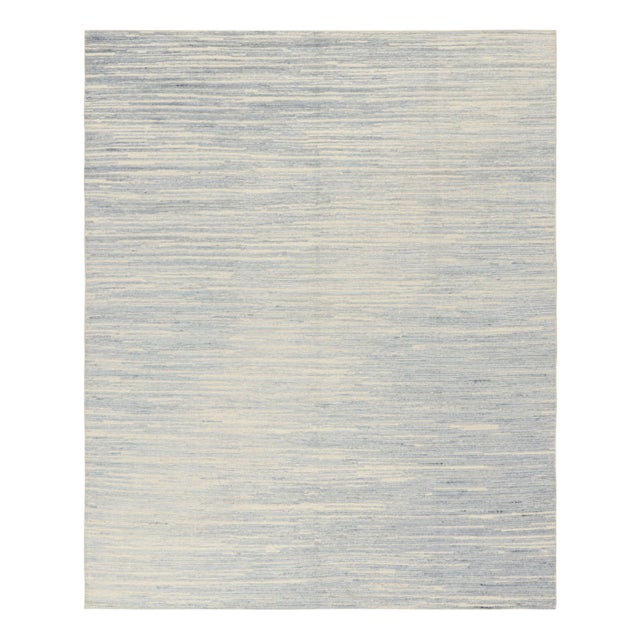 Hand-knotted in wool, this 8x10 textural rug by Rug & Kilim enjoying beige-brown and blue high low stripes and striae, is...