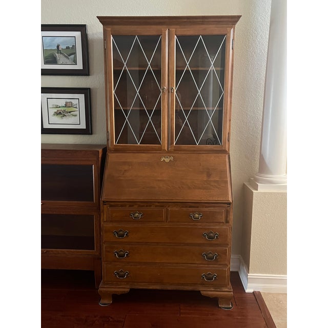 The Ethan Allen Heirloom Collection Secretary Desk, Top, and Chair is a unique and elegant piece of furniture that exudes...