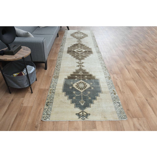 This vintage hand-knotted area rug is a semi-antique vintage area rug. The '70s Eastern region of Anatolian's unique rug...