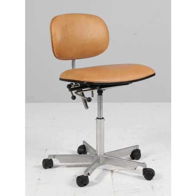 Kevi office chair designed by Jørgen Rasmussen. with height, tilt and other adjustments. New upholstered with tan aniline...