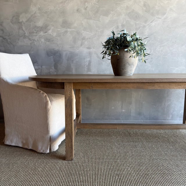 Introducing our exquisite Amber oval dining table, crafted from beautiful white oak for a touch of elegance. Its solid...