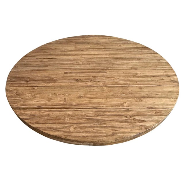 Salvaged teak wood dining table with beautiful medium brown walnut finish. Bowed wood base and round top. Great for...