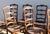 Brown Vintage 1950s Italian Provincial Carved Wood Dining Chairs With Rush Seats – Set of 12 For Sale - Image 8 of 18