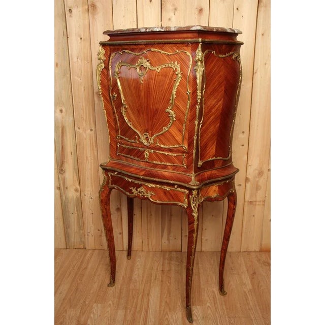 XIXth Napoleon III period buffet, beautifully made to rich ornaments of golden bronzes model with a door, two drawers and...