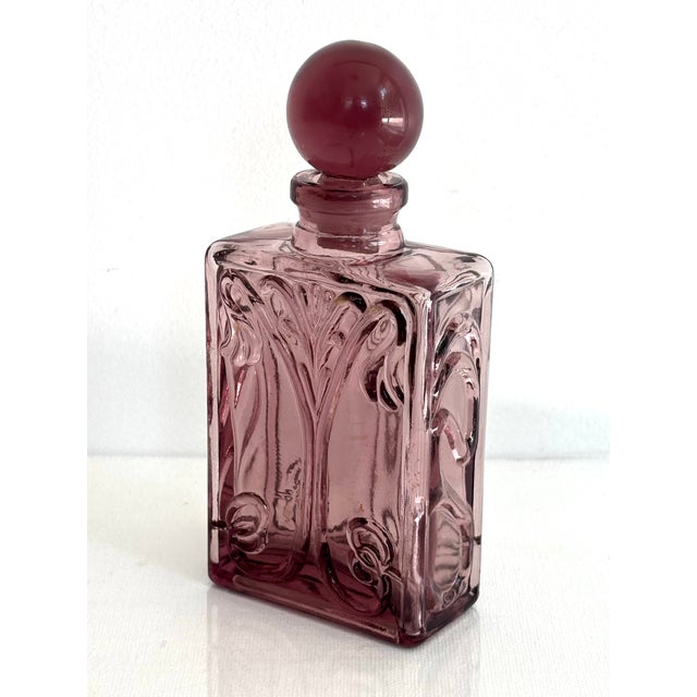 Pretty Art Nouveau mauve glass perfume bottle with a chic ball stopper. Most items found at Pub & Oasis are vintage and...