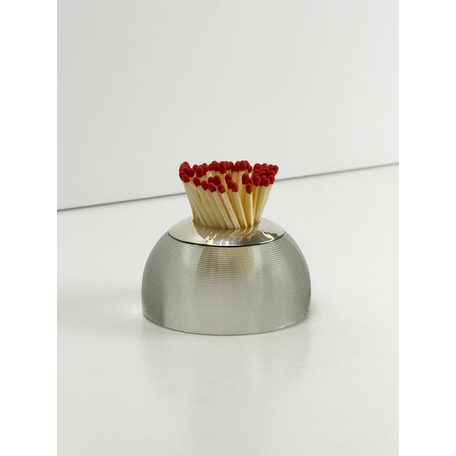 An English Victorian match striker dating to 1899, combining finely ribbed clear glass with a hallmarked sterling silver...