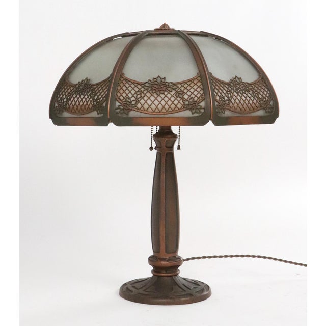 Art Nouveau style table lamp with soft geometry and floral details complemented by bronze metal construction. Some Arts &...
