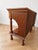 A refined pair of bedside tables (or nightstands) crafted from solid mahogany with a mahogany crotch veneer, featuring a...