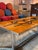 A vintage ceramic tile coffee table designed by Adri Belgique, circa 1960s. Featuring an orange glaze with an abstract...