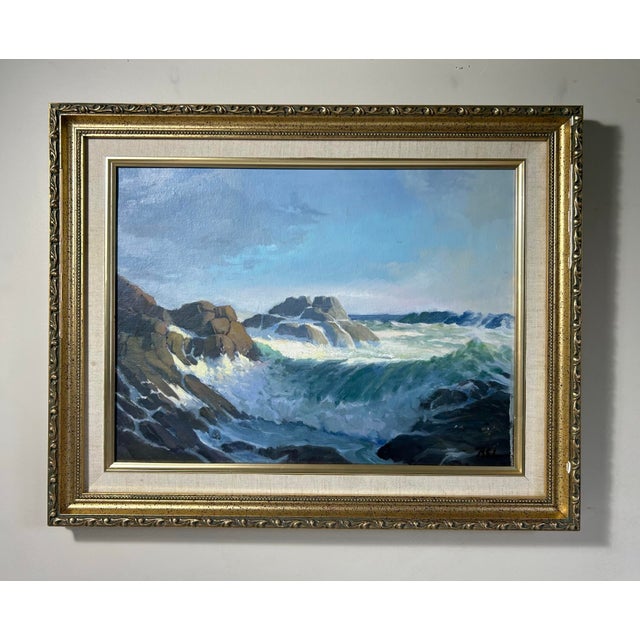 Vintage oil painting of a rocky coast seascape. In vintage gold frame with linen liner. Painting is signed to the lower...