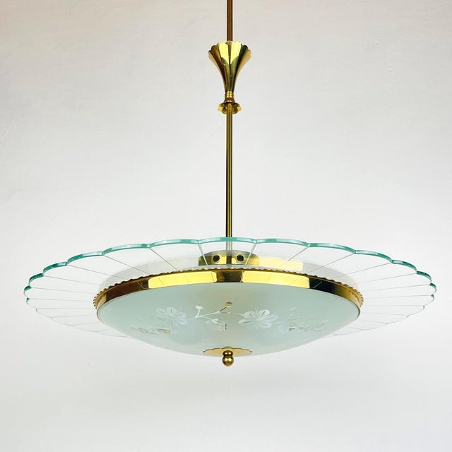 Vintage disk chandelier by pietro chiesa for fontana arte made in italy in the 1940s. three exquisitely sculpted and...