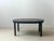 Extendable bjursta dining table from ikea in black-brown with a simple, scandinavian design. When closed, the table has a...