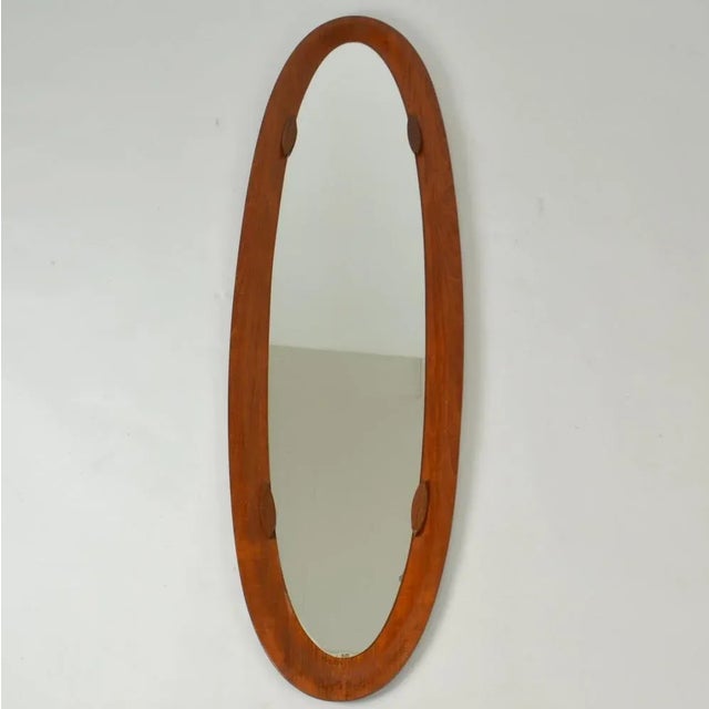 Large elegant oval mirror by designers Franco Campo & Carlo Graffi for Home Turin 1950's Italy housed in a bent plywood...