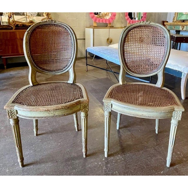 This product is a pair of antique French Louis XVI side chairs. The chairs have a classic and elegant design typical of...