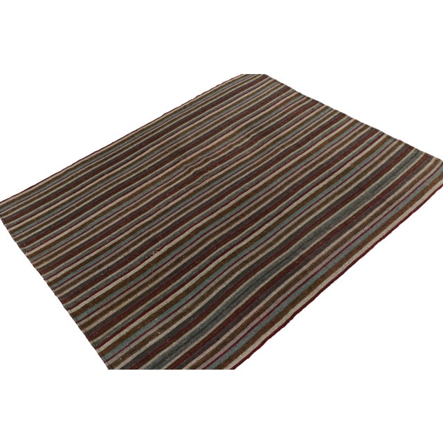 Hand woven in wool originating from Turkey between 1950-1960, this vintage mid-century Kilim enjoys one of the most subtle...