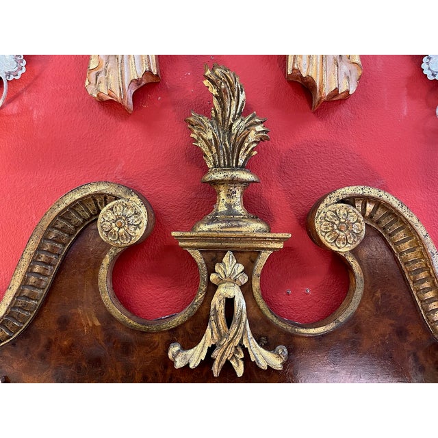 Beautiful Italian take on the traditional Chippendale broken pediment mirror. The frame is hand carved wood with rich burl...