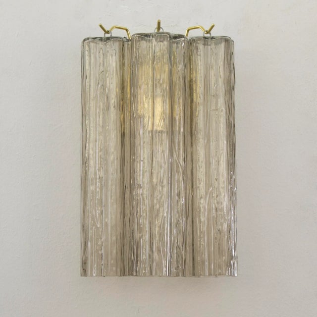 "tronchi" wall applique is made up of elements in blown glass tubes called "trunks" because of the shape reminiscent of a...