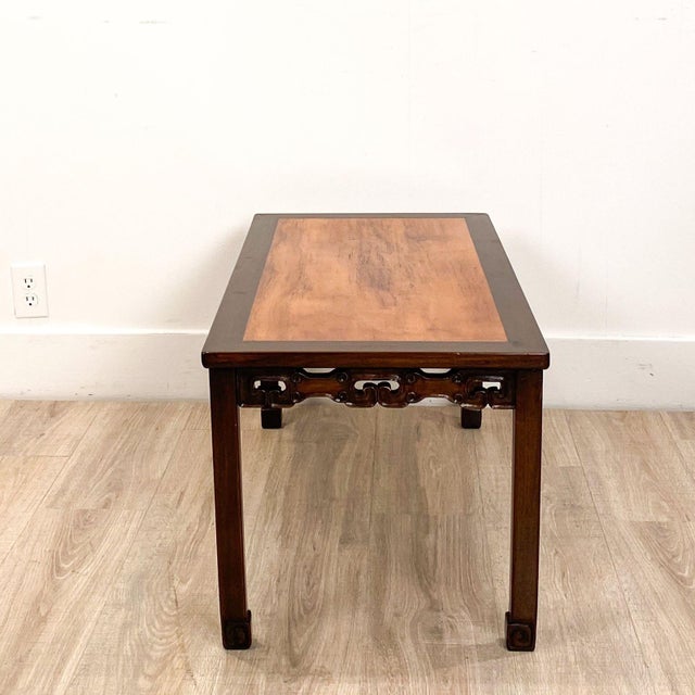 A vintage Chinese mixed wood low table, with nice carving.