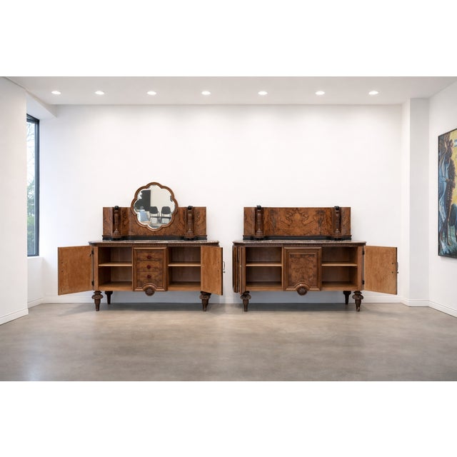1) Elegant sideboard with rounded sides, featuring two doors with burl veneer reliefs alternating with ebonized frames....