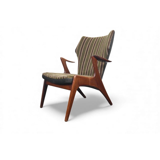 Origin: Denmark Designer: Kurt Østervig (attributed) Manufacturer: Rolschau Mobler Era: 1960s Materials: Afromosia, Wool...