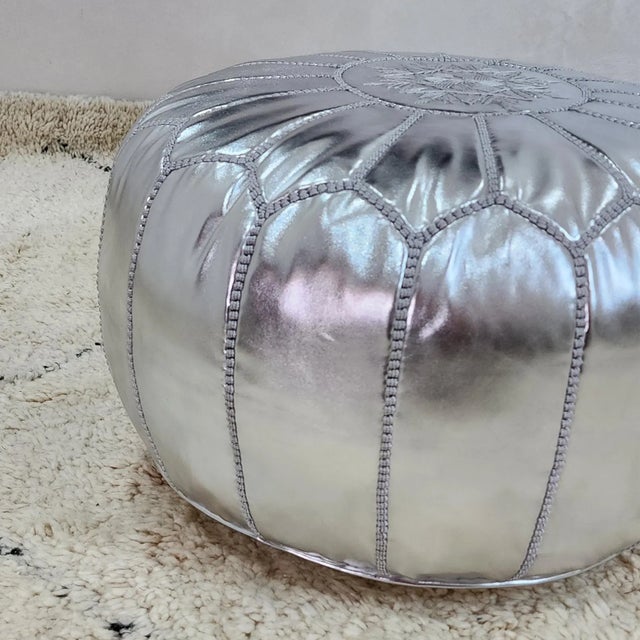 Bring a refined Moroccan touch to your space with this beautifully handcrafted leather pouf cover, made by skilled...