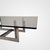 The "Floarian" table designed by Carlo Scarpa in 1973 features a satin-finish steel base and a clear glass top. Dimensions...