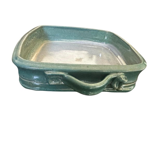 Elevate your space with this one-of-a-kind handmade pottery sculpture—a square bowl with sculptural handles, thoughtfully...