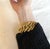 Stunning vintage Yves Saint Laurent bracelet Large, interwoven links in gold-tone metal Adjustable length; links can be...