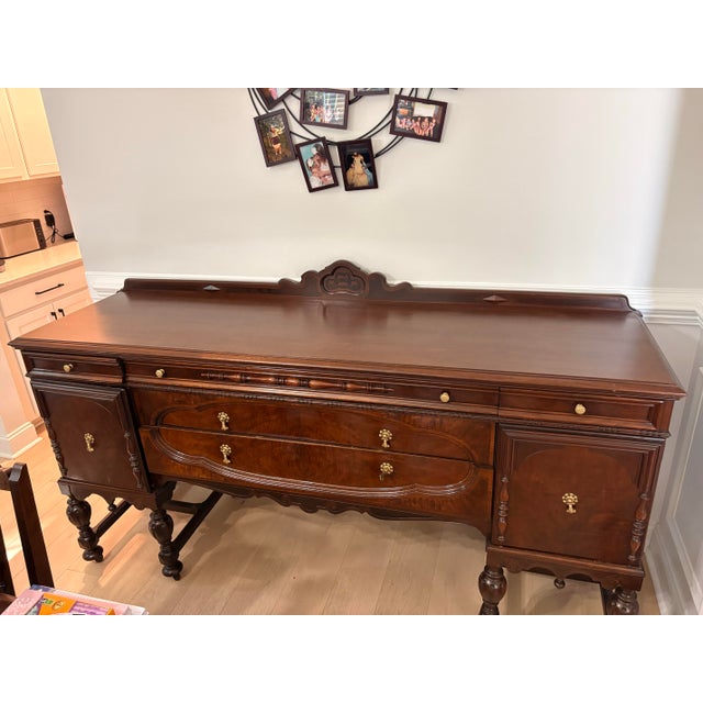 One of a kind antique Jacobean china cabinet from the 1920s. Solid, walnut well-crafted piece with timeless character-...
