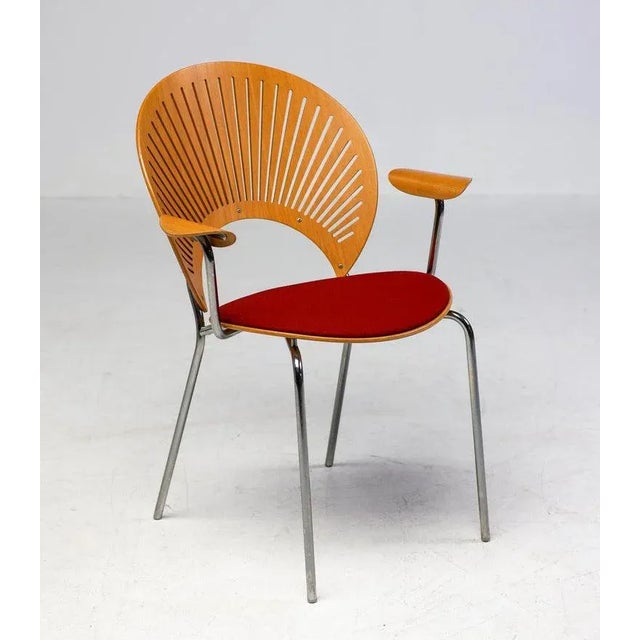 Very rare Trinidad teak dining chairs with arms by Nanna Ditzel for Fredericia Stolefabrik Denmark, circa 1995. The seat...