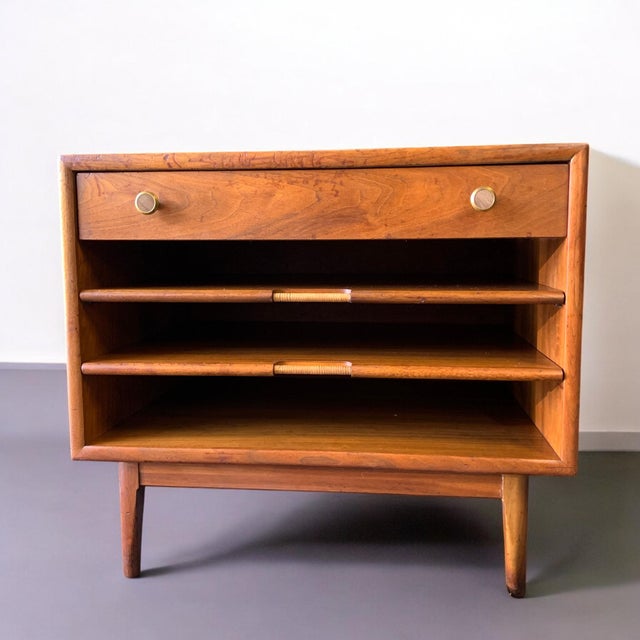 Expertly crafted in the 1960's by Drexel this vintage walnut end table from the Declaration line was designed by Kipp...