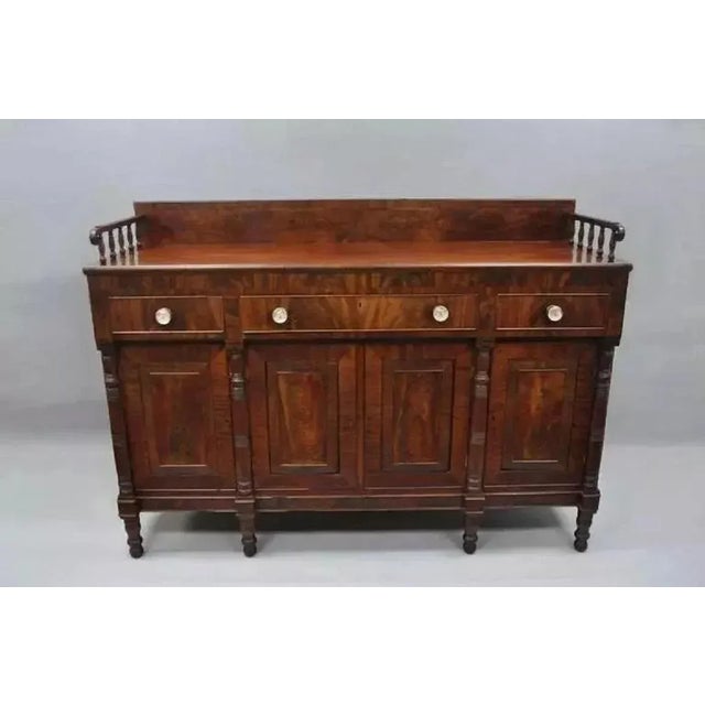 Antique 19th C. American Empire Crotch Flame Mahogany Sideboard Buffet. Item features 2 pull out surfaces on the sides,...