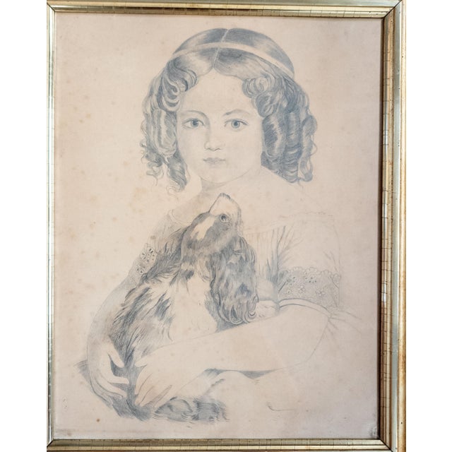 We are selling this fine Victorian pencil drawing of a Young girl with her King Charles Spaniel. The pencil portrait is...
