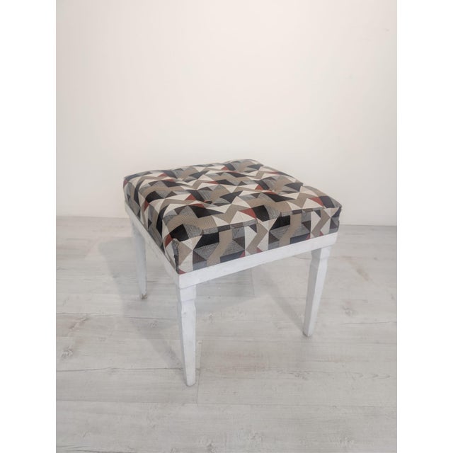 Whitewashed Pouffe, Stool, with Ladder This pouffe, stool, is white with a geometric pattern in shades of gray and brown....