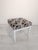 Whitewashed Pouffe, Stool, with Ladder This pouffe, stool, is white with a geometric pattern in shades of gray and brown....