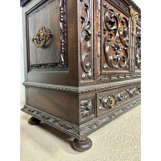 Magnificent Spanish blanket chest crafted in richly carved wood with bold Renaissance Revival styling. The chest features...