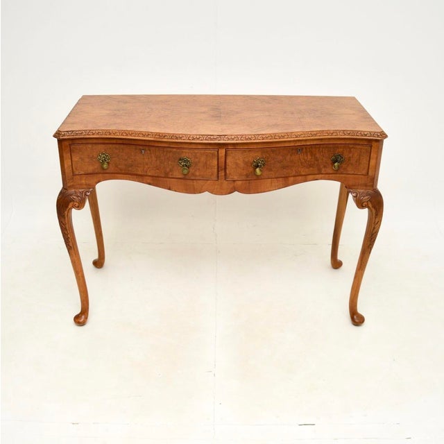 A superb antique burr walnut console / side table in the Queen Anne style. This was made in England, it dates from the...