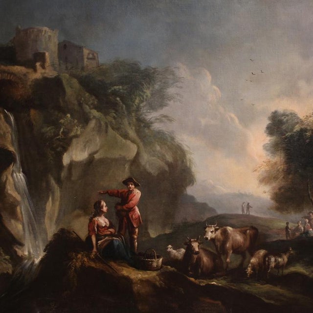 A magnificent italian painting from the mid-18th century. This artwork oil on canvas depicts a broad landscape animated by...