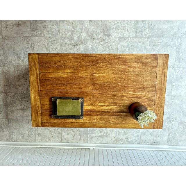 This is a high‑quality coffee table by Ethan Allen, thoughtfully refurbished by our studio. The piece features a solid...