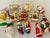 Dozen of blown glass Handpainted Christmas ornaments, including Gingerbread, Santa’s and Snowman.