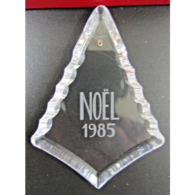 The Baccarat Crystal Boxed Christmas Ornaments from the years 1985, 1987, 1988, 1989, 1995, 1998 are a set of seven small,...