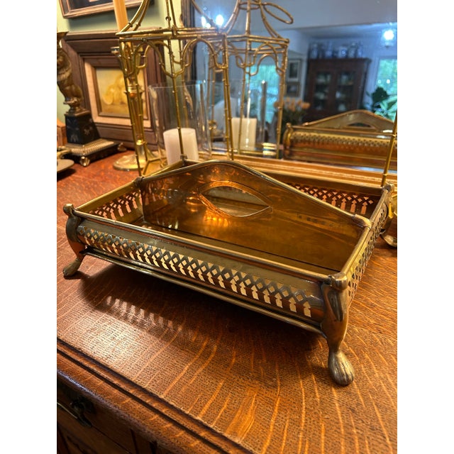 Technically, this brass tray would be used to organize cutlery on a sideboard… but the possibilities are endless. The...